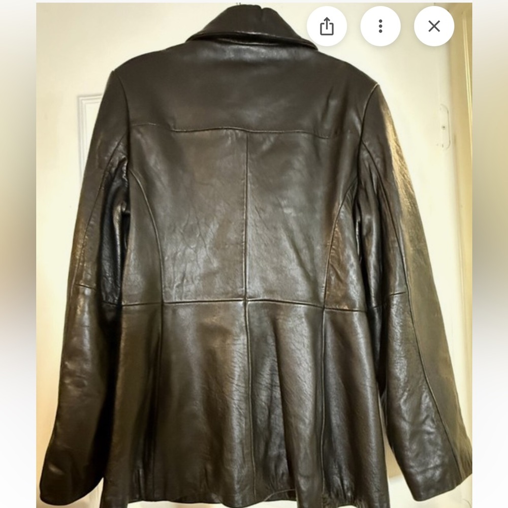 Women's Classic Black Leather Jacket, size medium, with pockets.